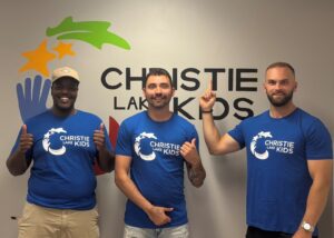 Picture of giveroo team members wearing Christie Lake Kids T-shirts